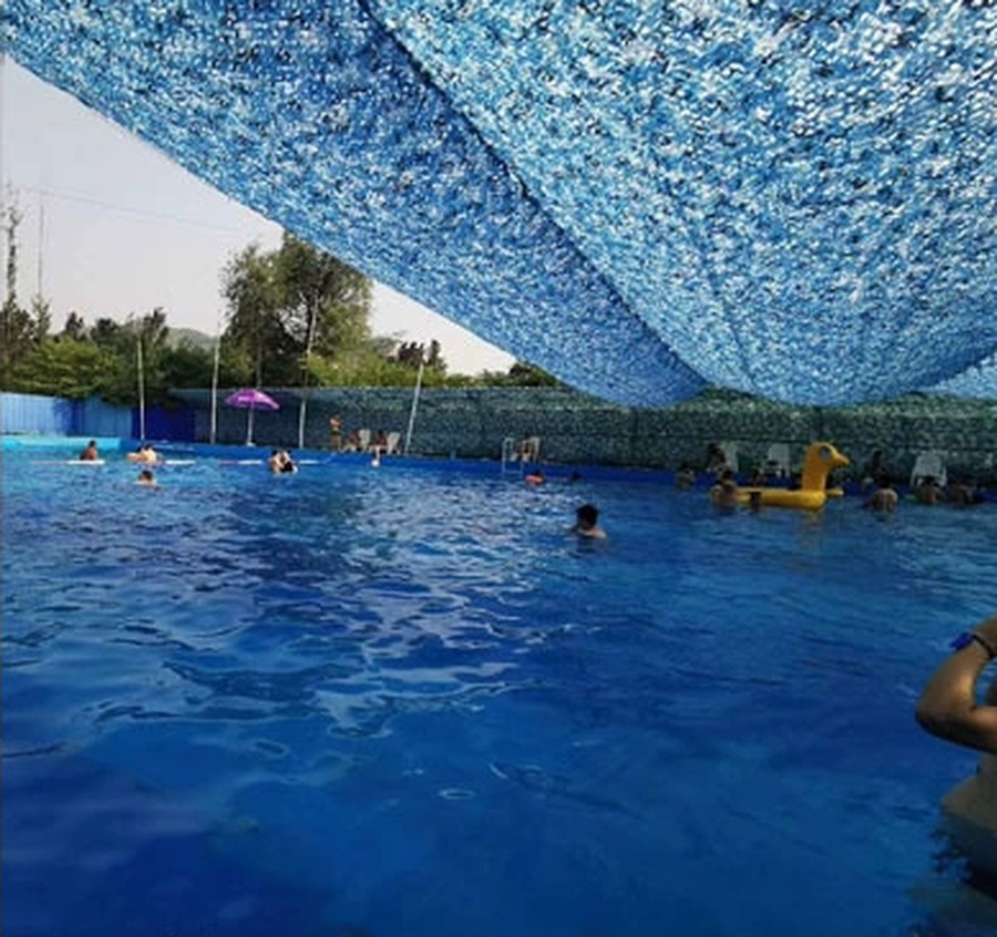 Ocean blue shade net over a swimming pool