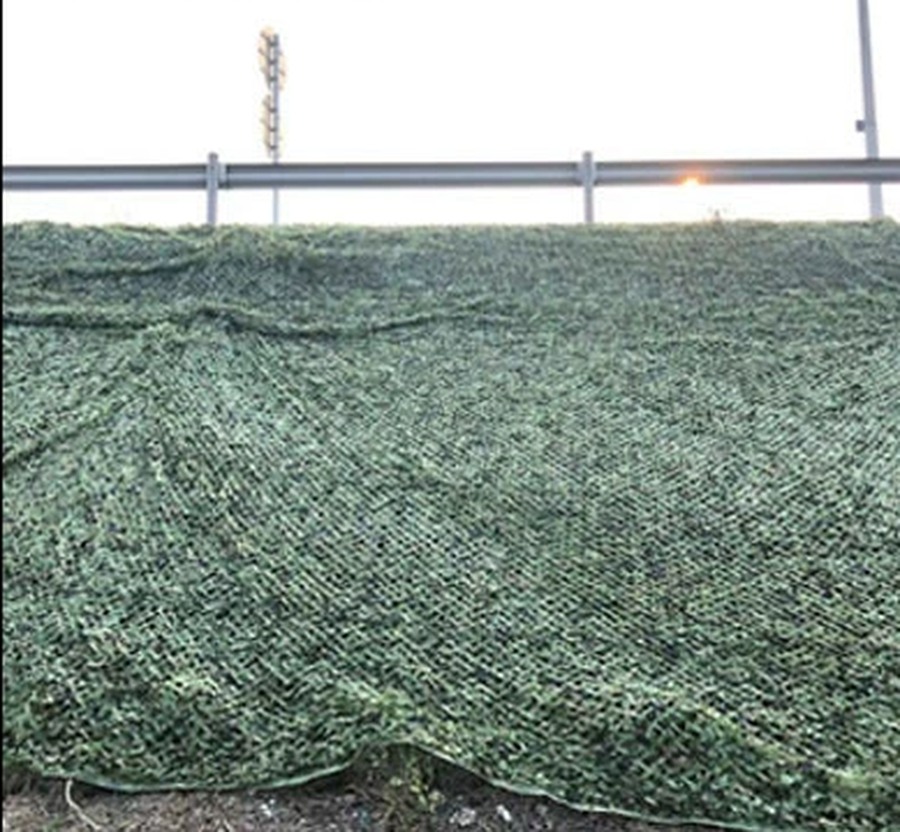Slope and roadside greening covered with camouflage netting